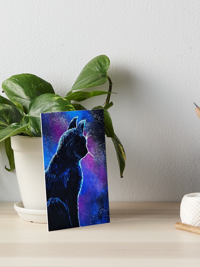 Vibrant painting of a black cat silhouette sitting in profile, looking out against a bright, starry cosmic background of deep blues and purples