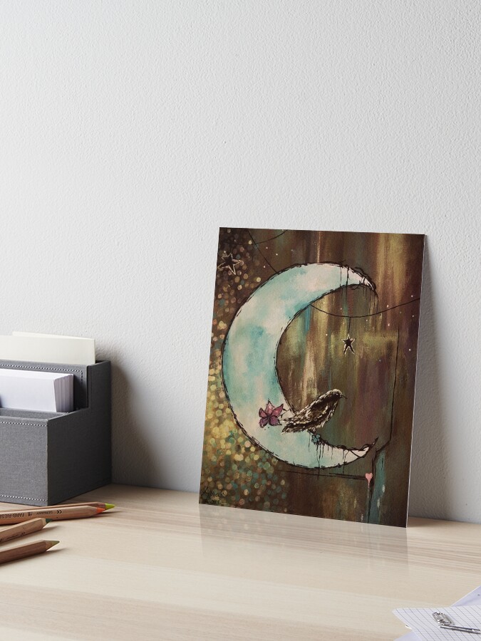 Painting of a small bird resting on a pale blue crescent moon with hanging star charms against a textured, earthy background